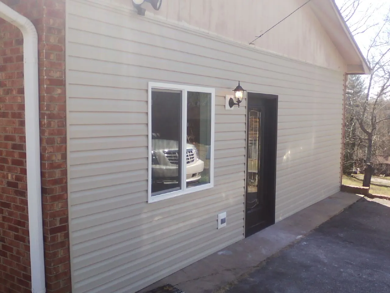 New vinyl siding and entry door on a room addition in Newbury Park